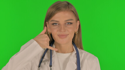 Portrait of Female Doctor inviting People for Help, Call Me on Green Background
