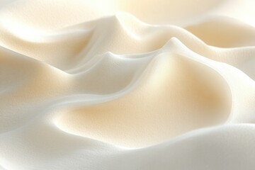 Obraz premium Abstract image of soft, creamy, undulating beige surface resembling whipped cream or clouds.