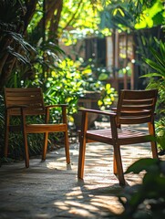 Obraz premium Relaxing chairs in a lush garden outdoor seating nature serene environment peaceful view tranquility concept