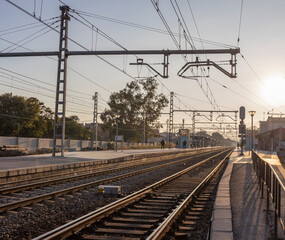Fototapeta premium Train station with a few people walking around
