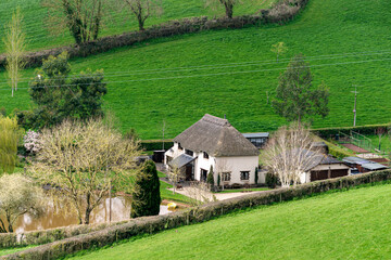 A small settlement on the slopes and meadows of Devon, England, Europe.