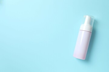 Cosmetic bottle on blue background 