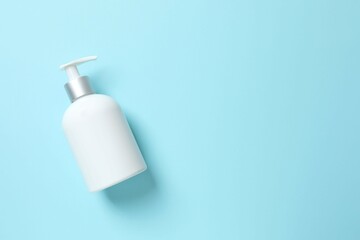 Cosmetic bottle on blue background 