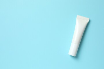 Cosmetic tube on blue background 