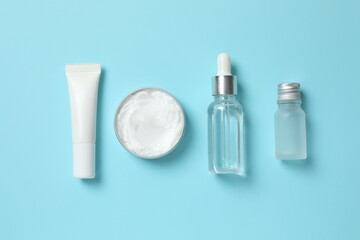 Natural cosmetic products on a blue background, top view