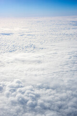 Obraz premium View of clouds from airplane window, clouds in a blue sky