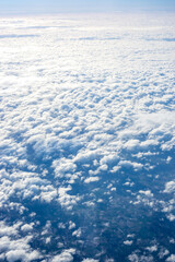 Obraz premium View of clouds from airplane window, clouds in a blue sky