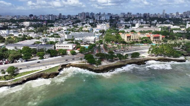 Santo Domingo, Dominican Republic, westbound flight from Rodo Park along shoreline and  Av. George Washington (Malec&oacute;n) until Monument to the Heroes of Constance, 4k aerial video footage