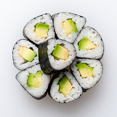 Rolls of Sushi Arranged in a Beautiful Floral Pattern Featuring Avocado and Rice, Showcasing Culinary Art on a Clean Background in a Modern Setting