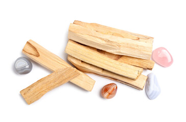 Palo santo sticks and gemstones isolated on white, top view