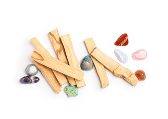 Palo santo sticks and gemstones isolated on white, top view