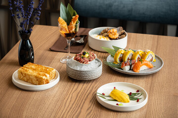 Savoring a Delightful Culinary Experience With an Elegant Spread of Modern Asian Cuisine at a Cozy...