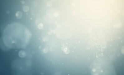 Soft blue bokeh background with light spots.