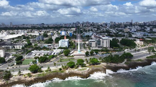 Santo Domingo, Dominican Republic, hovering in front of Monument to the Heroes of Constance, Maimon and Estero Hondo located in park Centro de Los Heroes at shoreline,  4k aerial video footage
