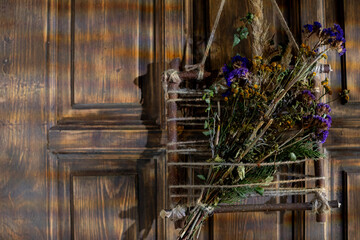 A Charming and Beautiful Floral Arrangement Elegantly Displayed on a Rustic Wooden Door