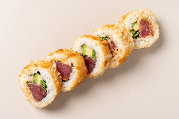 Crispy Sushi Rolls With Fresh Tuna and Vibrant Fillings Presented Elegantly on a Light Surface