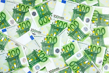 100 euro banknotes filling the frame. A simple finance and business concept