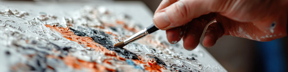 Fototapeta premium Hand Mixing Oil Paints on Palette