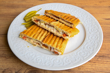 Turkish karisik atom Ayvalik tost ( kasarli bazlama tost) . Sucuklu, Kasarli, kavurmali karisik tost. Flat baked bread toasted. Karisik bazlama tost .  