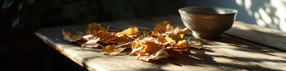 Dried Leaves and Ceramic Bowl on Wooden Table