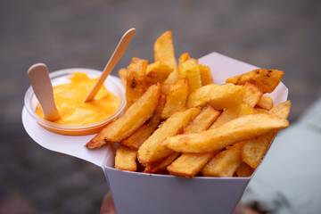 On a walk, we can stave off hunger with these Belgian potato fries with cheddar dressing.