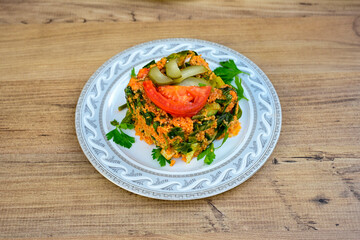 Traditional turkish bulgur pilaf with tomato sause in plate (Turkish name; bulgur pilavi, meyhane pilavi) Pirinc pilavi. Pilavustu tavuk, nohut, kuru fasulye, ciger.