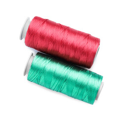 Spools of bright sewing threads isolated on white, top view
