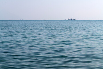 Obraz premium tranquil seascape with calm sea and fishing boat