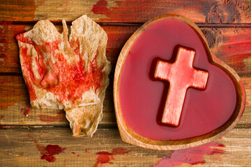 a cup of wine and bread in blood