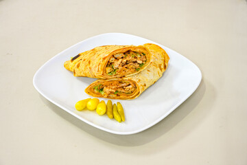 Lavash zurna doner kebab ( zurna  durum )  or shawarma sliced in plate isolated.  hatay usulu tavuk Et doner durum. Gobit ekmek arasi doner. Pilavustu iskender doner kebap. 