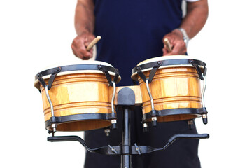Fototapeta premium Close up man is beating the bongo drums. Concept, musical percussion instrument for rhythm of music to make more fun for performing or dancing. Beat drum with rhythm along music and songs.