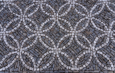 Cobblestone street with circular ornaments - top view