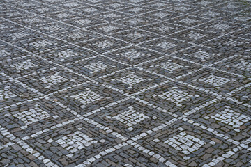 Cobblestone street with square shaped ornaments - surface level