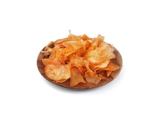 keripik singkong or Cassava chips on plate with high angle view, isolated on white background, Indonesian typical food or snack.