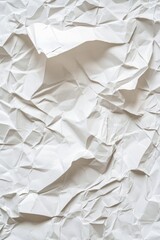 Obraz premium White crumpled and creased paper texture background with glued, wrinkled, and folded details, ideal for a vintage or artistic design.