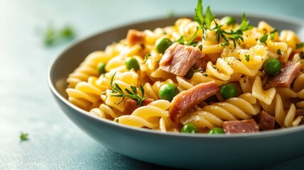 A vibrant plate of pasta with ham and green peas, garnished with fresh herbs, showcases a mouthwatering meal perfect for Italian cuisine enthusiasts.