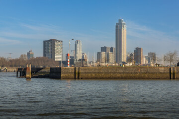 Fototapeta premium Zalmtoren and buildings in the area, in the foreground part of the dock of Katendrecht