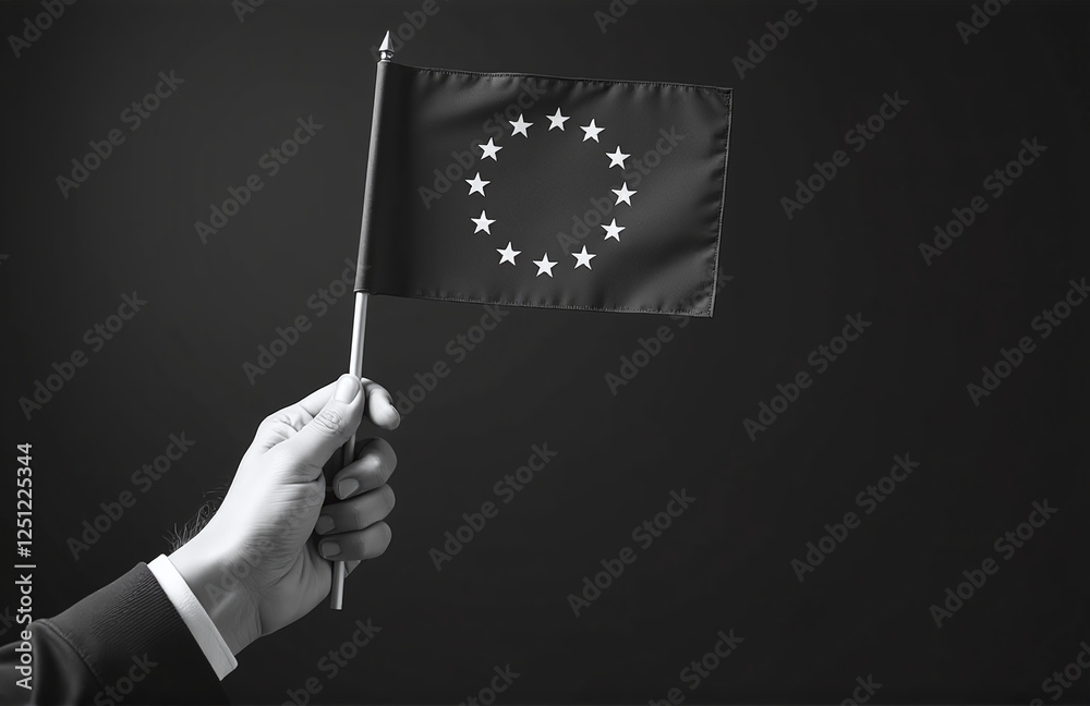 Poster a person holds a flag representing the european union with their hand in a black and white image for