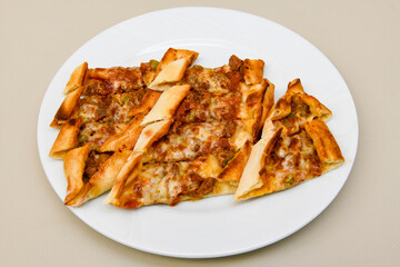 Kiymali pide.Turkish pide with minced meat. Turkish pizza mince pita Pide on white . Etli ekmek.Kusbasi kasarli, kiymali kasarli, kiymali yumurtali, Bafra, Trabzon, Kusbasili pide. Urfa acili lahmacun