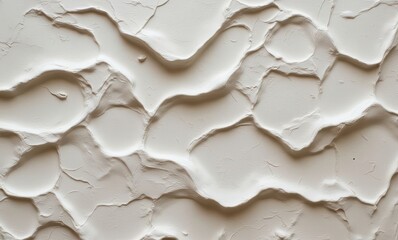 Textured white plaster wall surface