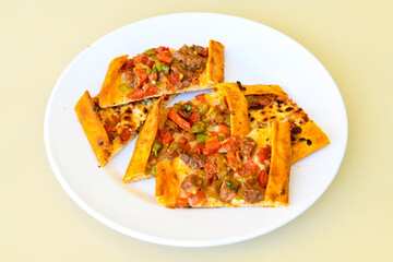 Kiymali pide.Turkish pide with minced meat. Turkish pizza mince pita Pide on white . Etli ekmek.Kusbasi kasarli, kiymali kasarli, kiymali yumurtali, Bafra, Trabzon, Kusbasili pide. Urfa acili lahmacun