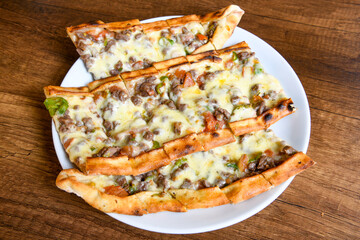 Kiymali pide.Turkish pide with minced meat. Turkish pizza mince pita Pide on white . Etli ekmek.Kusbasi kasarli, kiymali kasarli, kiymali yumurtali, Bafra, Trabzon, Kusbasili pide. Urfa acili lahmacun