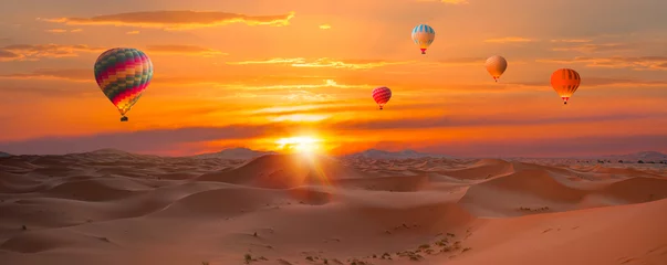 Fototapete Rund Tiefes Orange Hot air balloon flying over beautiful sand dunes in the Sahara desert - Sahara, Morocco  © muratart