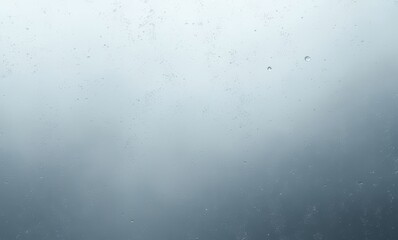 Moody mist and raindrops on glass