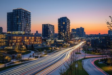 Naklejka premium City highway sunset light trails, urban development, evening commute