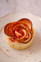 Apple roses Puff pastry sprinkled with red dry powdered strawberry. Romantic Dessert for Valentine's Day or Birthday. Twisted cake. Food photography and styling.