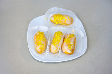 Ekler Pasta Turkish delicious ekler pasta with plate. Klasik, cikolatali, muzlu, frambuazli, karamelli, cilekli, oreolu ekler.