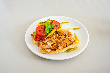 Lavash zurna doner kebab ( zurna  durum )  or shawarma sliced in plate isolated.  hatay usulu tavuk Et doner durum. Gobit ekmek arasi doner. Pilavustu iskender doner kebap. 