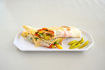 Lavash zurna doner kebab ( zurna  durum )  or shawarma sliced in plate isolated.  hatay usulu tavuk Et doner durum. Gobit ekmek arasi doner. Pilavustu iskender doner kebap. 