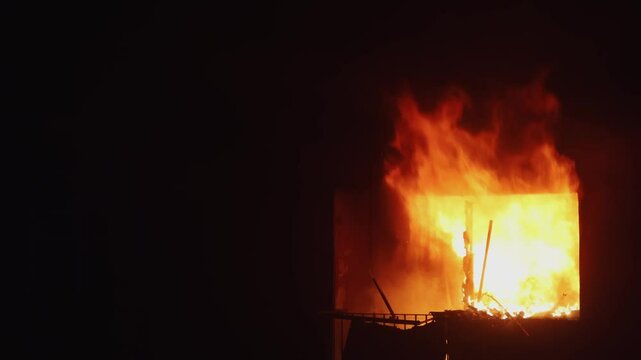 Fire in the building. Apartment is burning. Slow motion. High quality shooting in 4k format